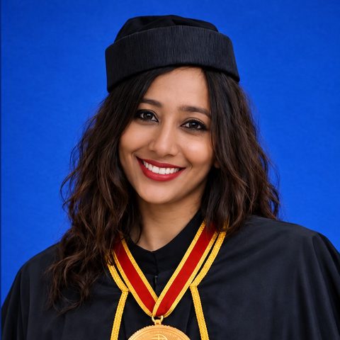 Lily Baylon Escrutora in academic robes