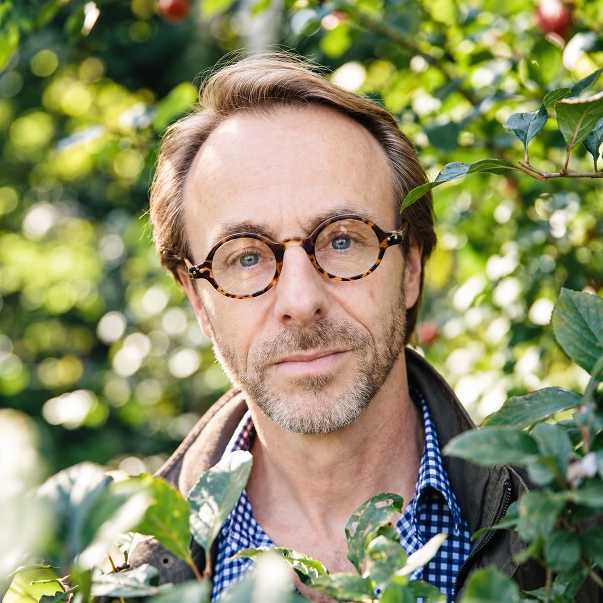 Mark Tredinnick among green foliage