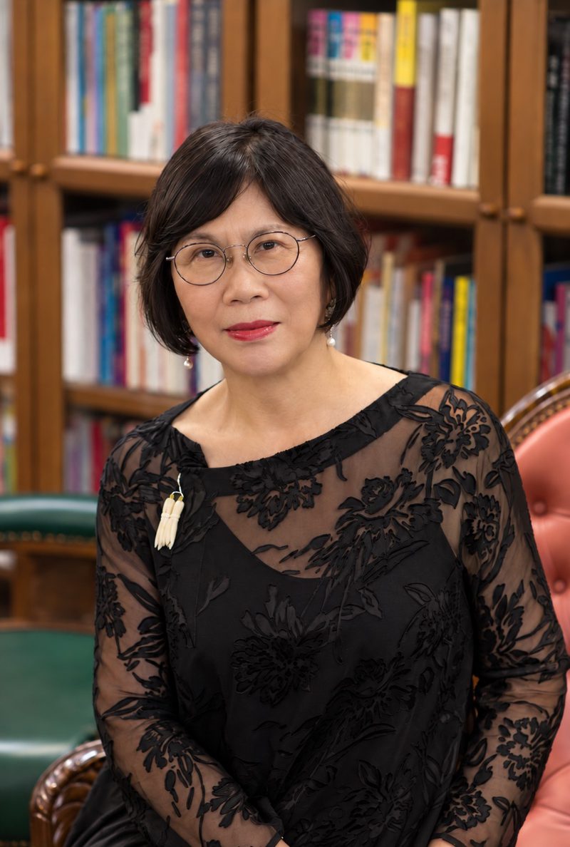 Ying Xia Tang, seated in a library