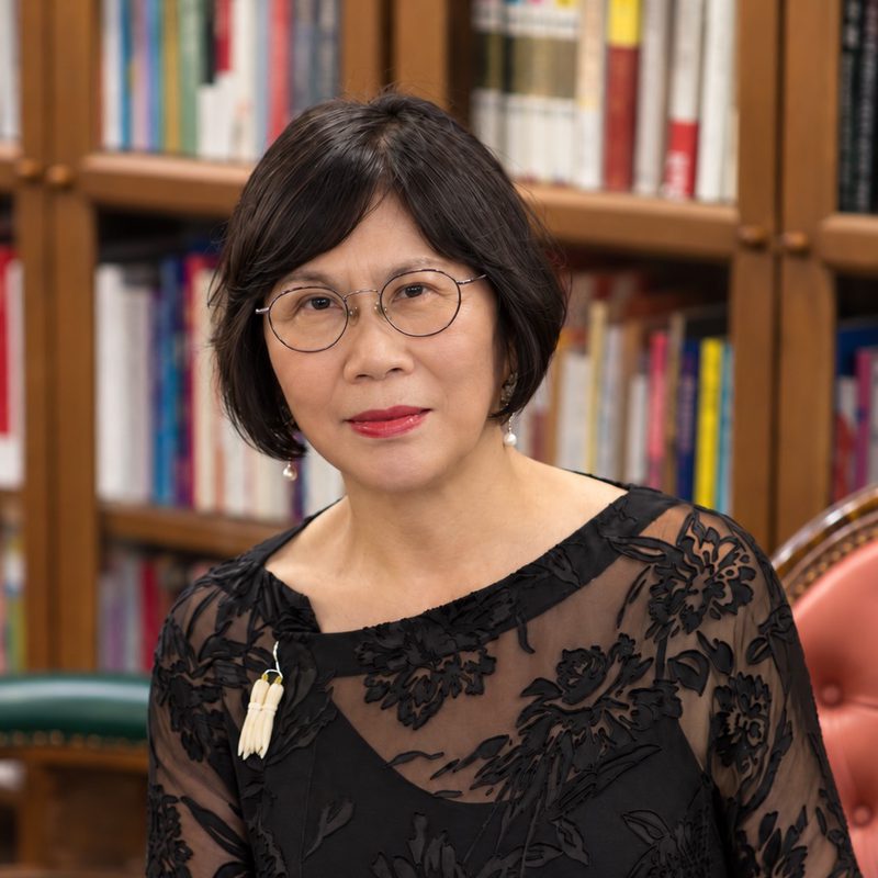 Ying Xia Tang, seated in a library